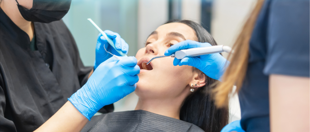 Woman getting a check-up at the dentist